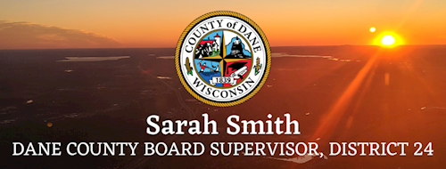 Image of Dane County from air with the County of Dane logo placed over the image. It also reads Sarah Smith Dane County Board Supervisor, District 24.